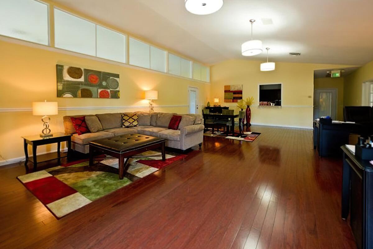 Open-plan living room with a dining table and decor.